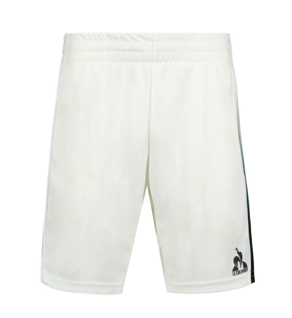 Le Coq Sportif Pro Men's Badminton Shorts in Marshmallow feature a dark green side stripe and black logo on the lower left leg, made from breathable fabric for optimal movement. Displayed against a white background.