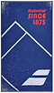 The Babolat Medium Towel - Sodalite Blue is an ideal choice for the court, crafted from 100% cotton. It boasts a blue design adorned with white geometric mountain-like shapes and small speckles. The red lettering proudly displays "Babolat SINCE 1875," along with the signature Babolat logo at the base.