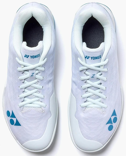 A pair of Yonex Power Cushion Aerus Z2 men's badminton shoes in white with blue accents, seen from above on a white background.