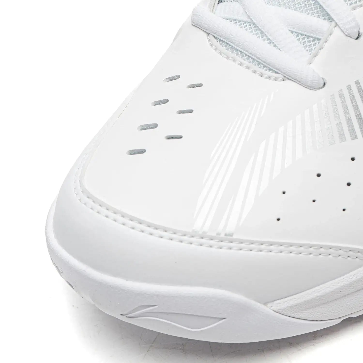 Close-up of the Li-Ning Sonic Boom Unisex Badminton Shoes - White, showing toe and side details with decorative perforations, white stitching, and silver accents for stability and protection, presented on a white background.