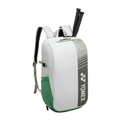 The Yonex 52512EX Club Badminton Backpack in white, designed for tennis and badminton gear, features gray accents, adjustable shoulder straps, and fits two racquets sticking out from the top. Lightweight yet durable, it's ideal for athletes on the go.