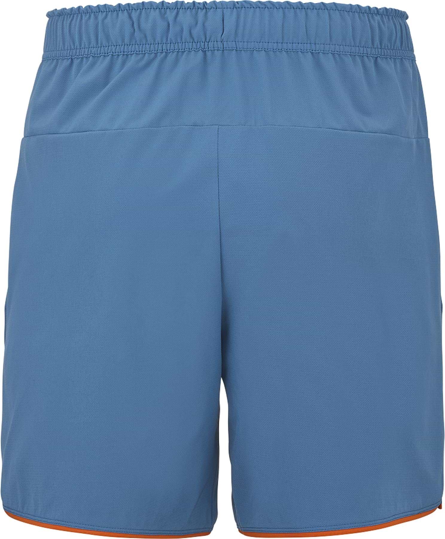 The Babolat Perf Men's Badminton Shorts in Seaport blue feature an elastic waistband and orange trim, shown from the back. These simple, comfortable shorts are perfect for badminton players seeking optimal performance.