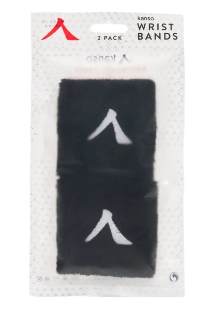 A 2-pack of Kanso black wristbands in clear packaging, labeled "Kanso 7cm Wristband - 2 Pack - Black," crafted from absorbent fabric for comfort. Each wristband features a white upward-facing arrow symbol.