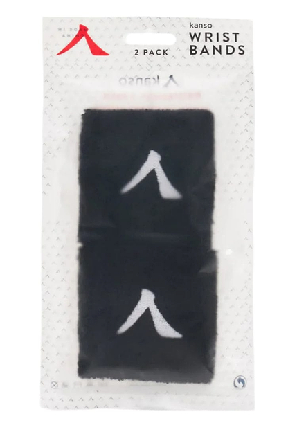 A 2-pack of Kanso black wristbands in clear packaging, labeled "Kanso 7cm Wristband - 2 Pack - Black," crafted from absorbent fabric for comfort. Each wristband features a white upward-facing arrow symbol.