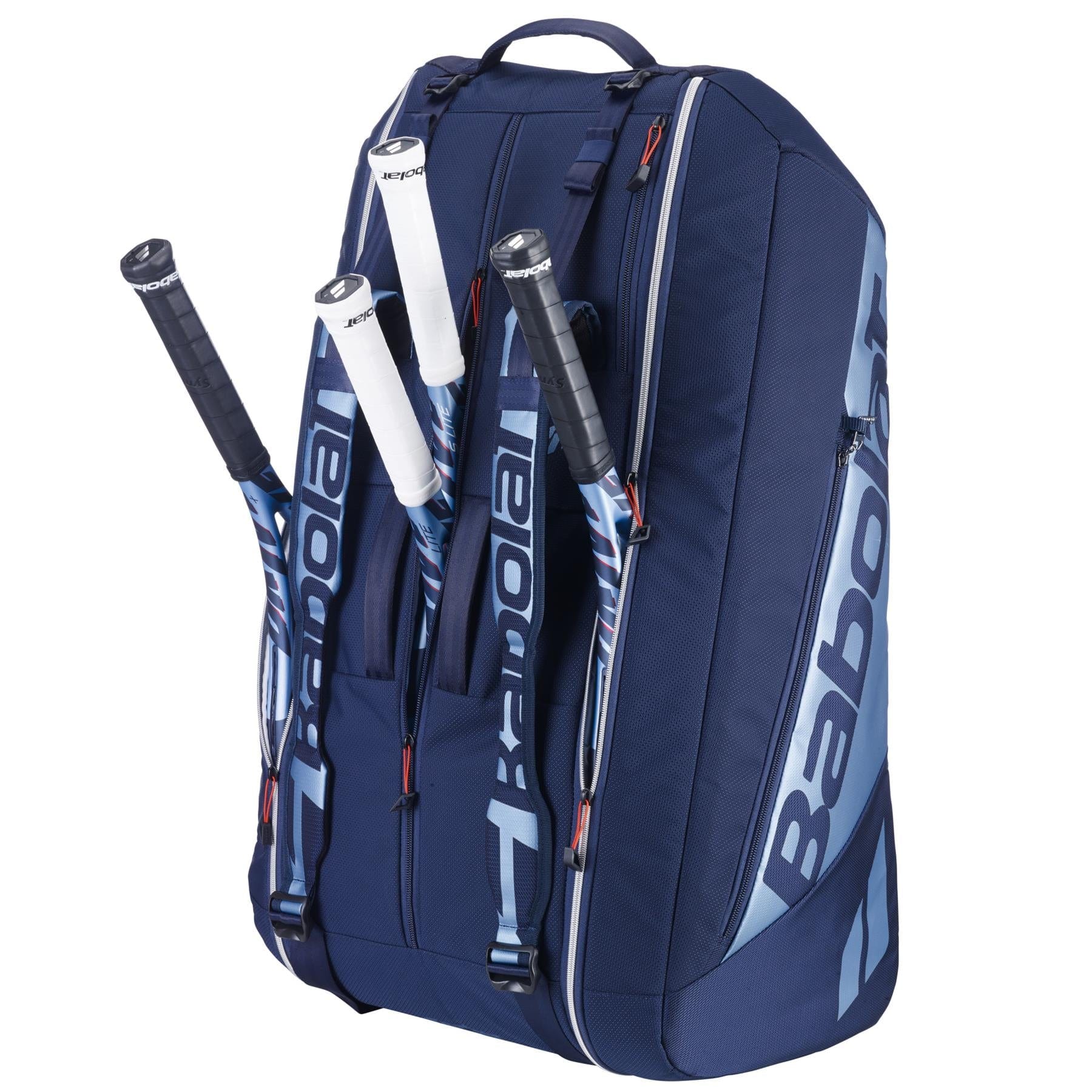 The Babolat RH12 Pure Drive Gen11 12 Racket Badminton Bag in Navy Blue features "Babolat" branding, multiple compartments for a large capacity, and three tennis rackets with white grips partially inserted. It includes a top handle and adjustable straps for easy carrying.