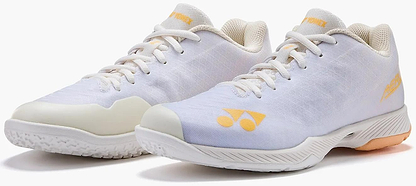 The Yonex Power Cushion Aerus Z2 Womens Badminton Shoes in white and orange feature the renowned Power Cushion for superior comfort, mesh uppers, and textured rubber soles—perfect for badminton enthusiasts.