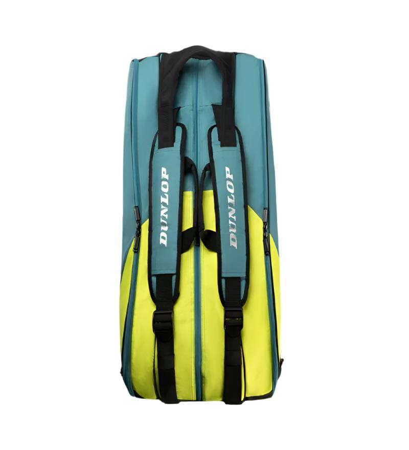 The Dunlop SX Performance 12 Racket Badminton Bag, in teal, black, and yellow, is designed to hold three rackets and features the "Dunlop" logo on ergonomic shoulder straps.