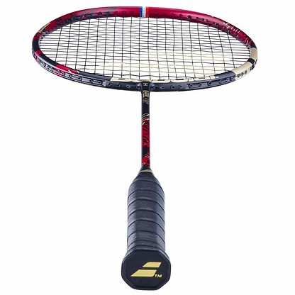 Close-up of the Babolat X-Feel Fury Badminton Racket in striking red and black, showcasing a white string pattern engineered for optimal power transmission. The black grip bears the brand's logo at the end, with the shot taken from the handle towards the racket's head.