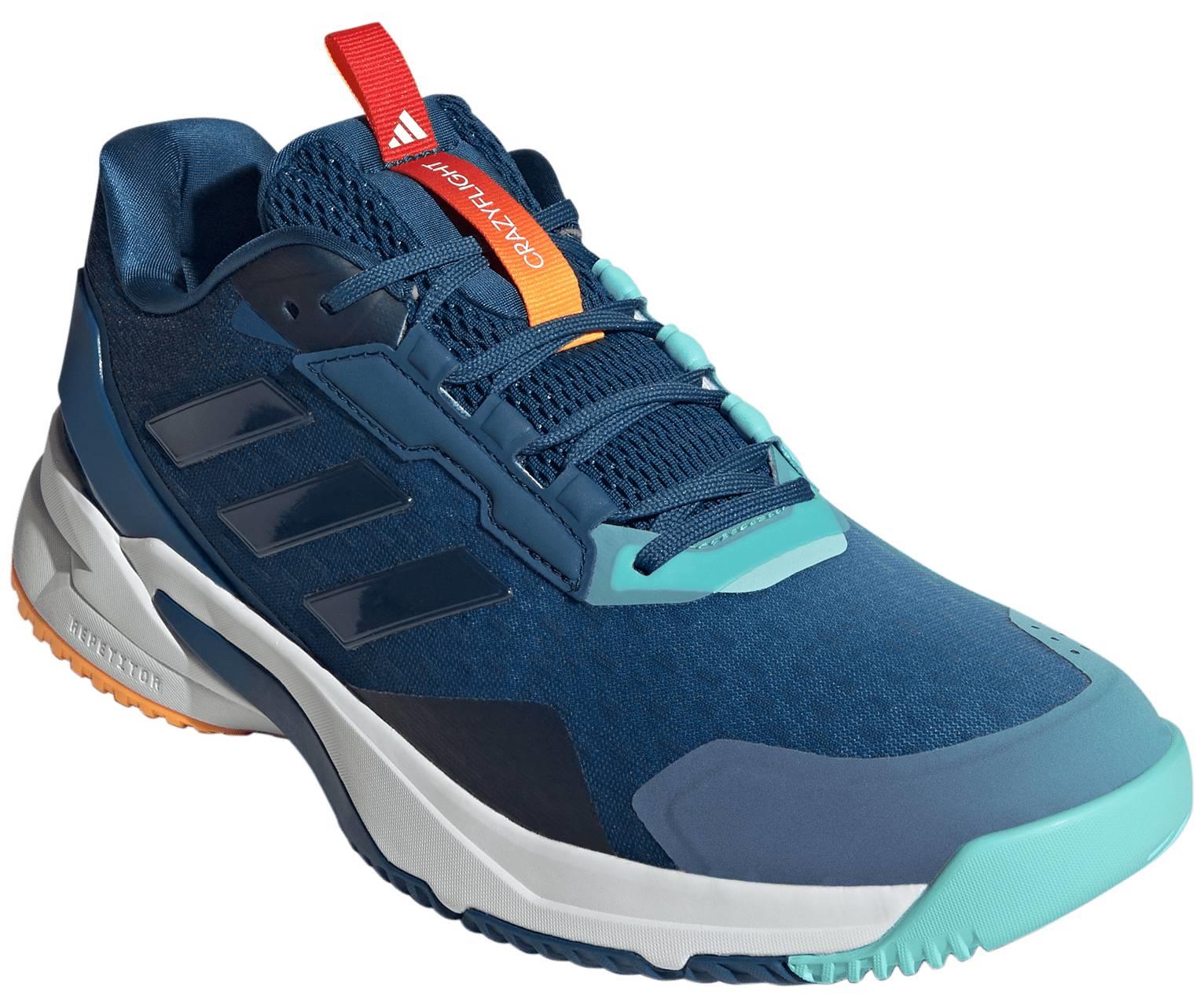 The ADIDAS Crazyflight 6 Mens Indoor Badminton Shoes by adidas feature a navy blue upper with turquoise accents, orange tongue and heel details, black side stripes, and a white sole with orange and blue sections—ideal for fast-paced indoor play.
