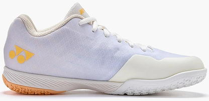 The Yonex Power Cushion Aerus Z2 Women’s Badminton Shoes in White/Orange feature textured soles for grip, white laces, and Yonex Power Cushion technology for enhanced comfort and support.