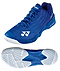 The Yonex Power Cushion Aerus X2 Unisex Badminton Shoes in navy blue are shown from the side and bottom, highlighting their white hexagonal-patterned sole with the Yonex logo, Power Cushion technology, white accents, and a lace-up design.