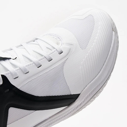 Close-up of Kanso's Equilibrium EQx3 Unisex Badminton Shoes in white/black; featuring Speedlight Foam for enhanced performance, a textured surface, white laces, and a detailed sole that highlights modern sportswear aesthetics and superior shock absorption.