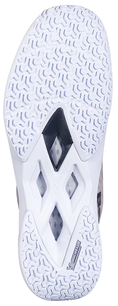 Close-up of the Babolat Shadow Tour 5 Womens Badminton Shoes (Pink/Green) outsole, showing patterned tread for indoor grip and diamond-shaped midfoot cutouts that expose inner components.