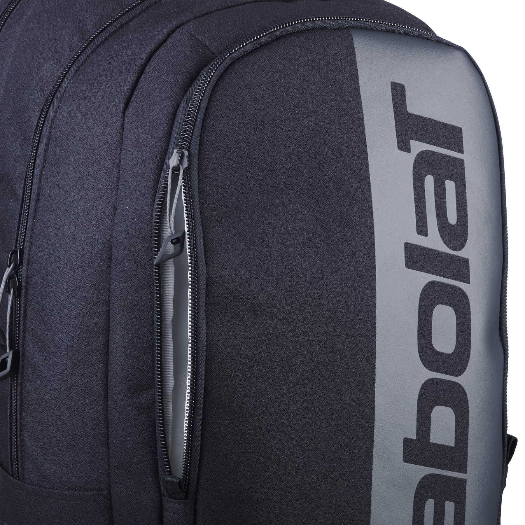 A close-up of the Babolat Court Hero Badminton Backpack in black, featuring "Babolat" prominently on the front. This eco-friendly bag is made from recycled PET and includes multiple zippered compartments for your badminton gear.