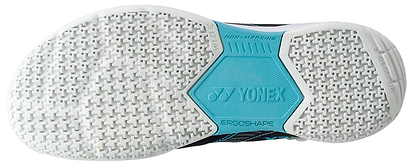 The Yonex Power Cushion Strider Flow sports shoe sole, ideal for badminton, features a white textured tread with a bright blue section marked "NON-MARKING," "YONEX POWER CUSHION," and "ERGOSHAPE.
