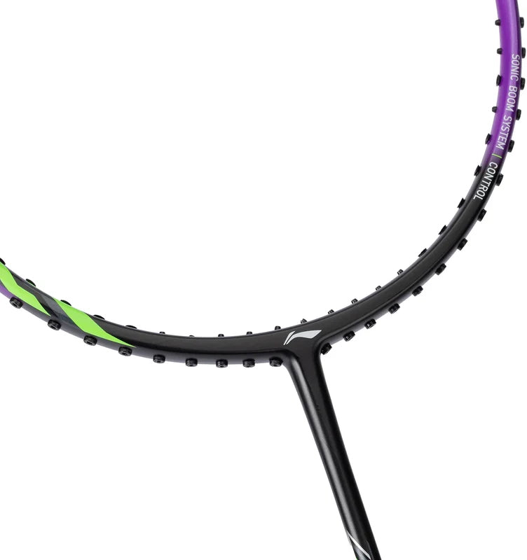 Close-up of the top section of the Li-Ning Halbertec 1000 Badminton Racket - Dragon Purple, highlighting its control-oriented design with a black frame accented in green and purple. Visible grommets for stringing are present, while the strings themselves are not shown in this cropped image.
