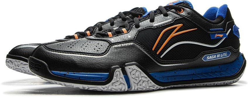 Black Li-Ning Saga III Lite Men's Badminton Shoes feature blue and orange accents, textured white soles, detailed stitching, Li-Ning Cloud cushioning, and "SAGA M LITE" text on the side.