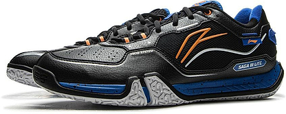 Black Li-Ning Saga III Lite Men's Badminton Shoes feature blue and orange accents, textured white soles, detailed stitching, Li-Ning Cloud cushioning, and "SAGA M LITE" text on the side.