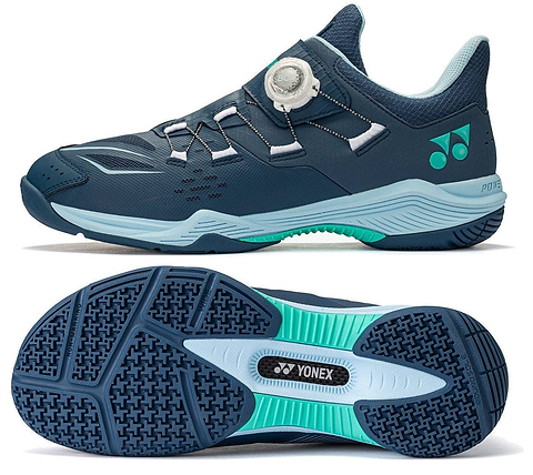 A navy and white Yonex Power Cushion 88 Dial 3 Wide unisex badminton shoe featuring the advanced BOA Fit System with a white BOA dial, green accents, and a light blue and black textured sole, shown from both the side and bottom views.