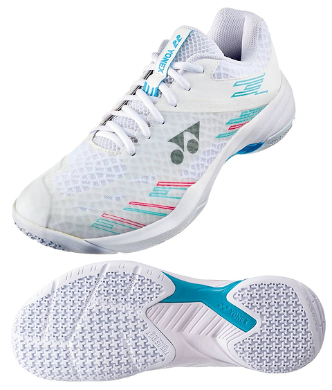 The Yonex Power Cushion Cascade Accel Wide Unisex Badminton Shoes in White and Light Blue feature a wide, athletic design with turquoise and pink accents. Displayed from a side angle alongside their textured grip sole showcasing the iconic blue Yonex Power Cushion logo, these court shoes offer superior stability and comfort for badminton players.