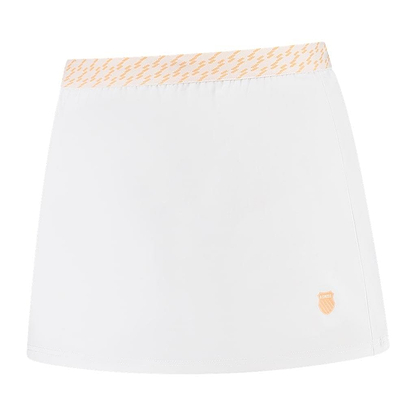 Introducing the K-Swiss Hypercourt Women's Badminton Skirt 5 in White: This athletic skirt showcases a subtle light orange zigzag pattern on the waistband. Designed for maximum comfort with its 4-Way Density Stretch, it features an integrated legging short and is adorned with a small orange shield logo at the bottom right corner.