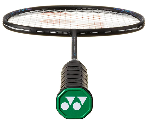 A close-up of the Yonex Nanoflare 002 Clear 4U Badminton Racket - Black / Blue shows its green cap with a white Yonex logo and a head-light black frame and strings in focus.