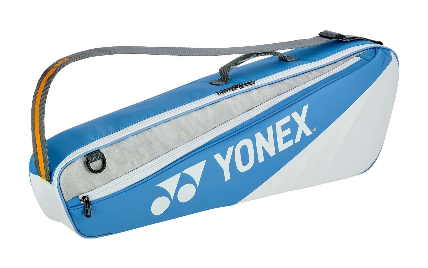The Yonex 52523EX Club 3 Racket Bag in Greyish Blue is ideal for tennis or badminton, featuring a shoulder strap and carrying handle. It has a spacious zippered compartment to neatly store rackets and essentials.