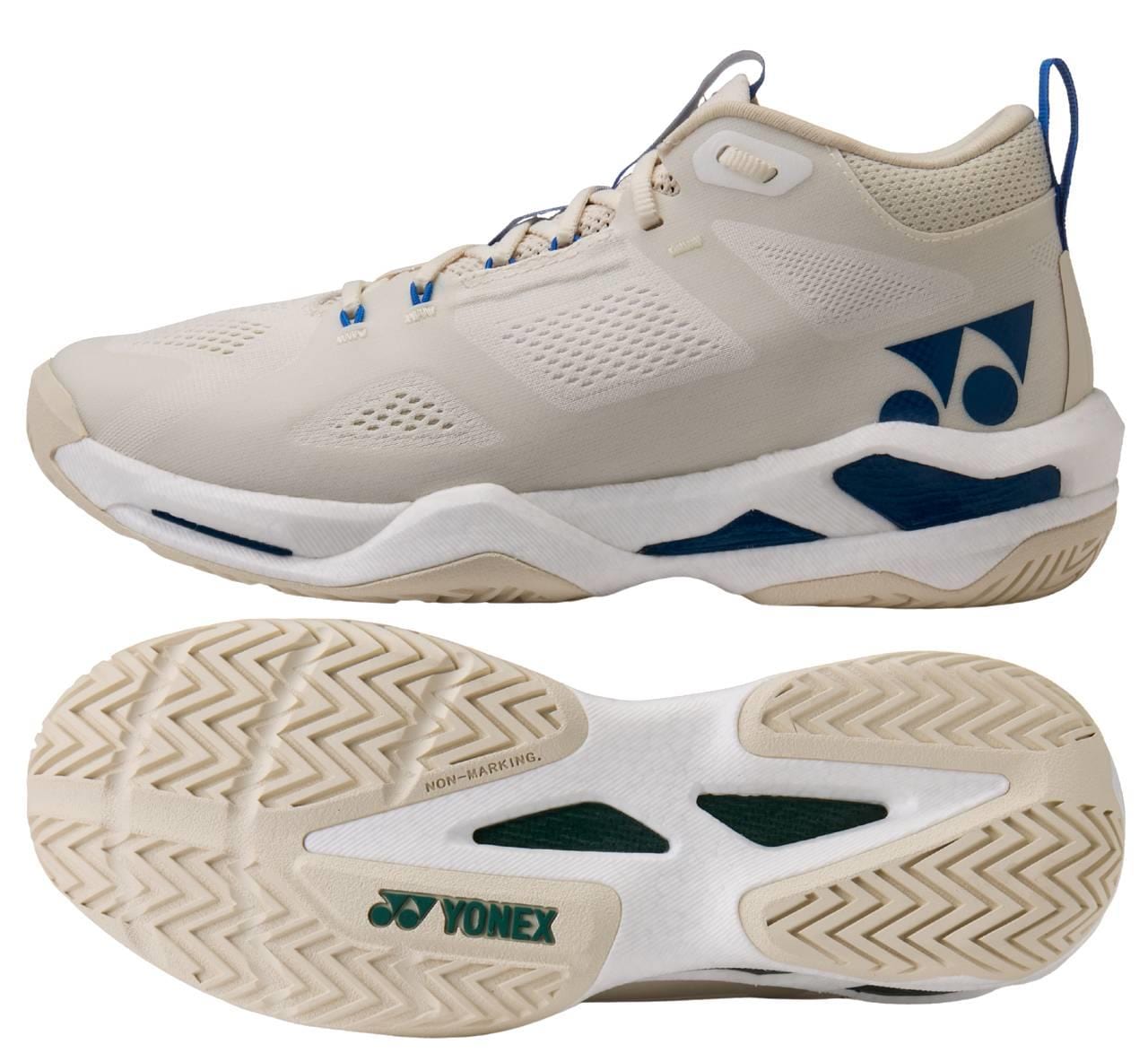 A pair of Yonex Power Cushion GRPHT THRTTL Concept men's badminton shoes in beige with blue accents and logo, featuring a breathable mesh upper, high-traction rubber sole with graphite throttle, and mid-top design; one side and one sole view shown.