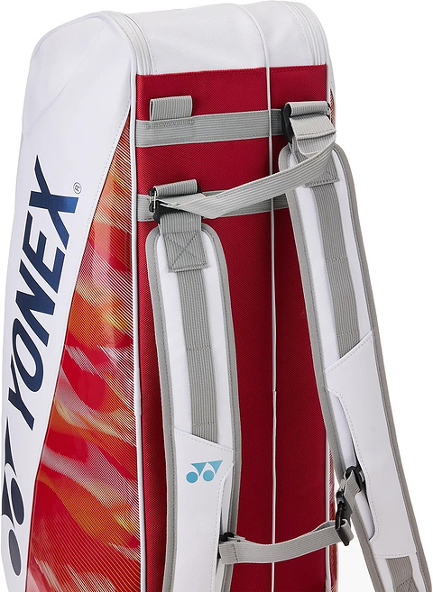 A close-up of the Yonex 02626EX Expert 6 Racket Badminton Bag in white, featuring red and orange accents, dual adjustable gray shoulder straps, Thermo Guard technology, and the Yonex logo on the side.