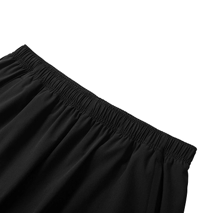 Close-up of Li-Ning Tournament Men's Badminton Shorts - Black, featuring an elastic waistband made with AT DRY technology for comfort and flexibility. The shorts, highlighted against a white background, epitomize high-performance badminton apparel from Li-Ning.