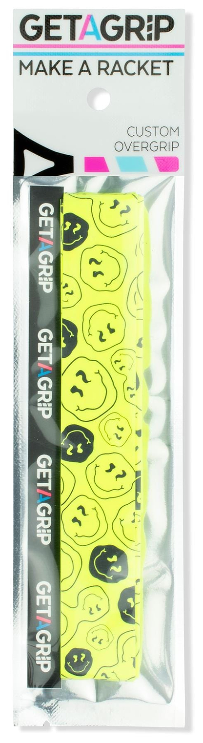 Get a Grip Badminton Overgrip - Smiley by Get A Grip: a bright yellow racket overgrip with black abstract smiley faces, ideal as a badminton gift. Packaged with the brand name and slogan "MAKE A RACKET.