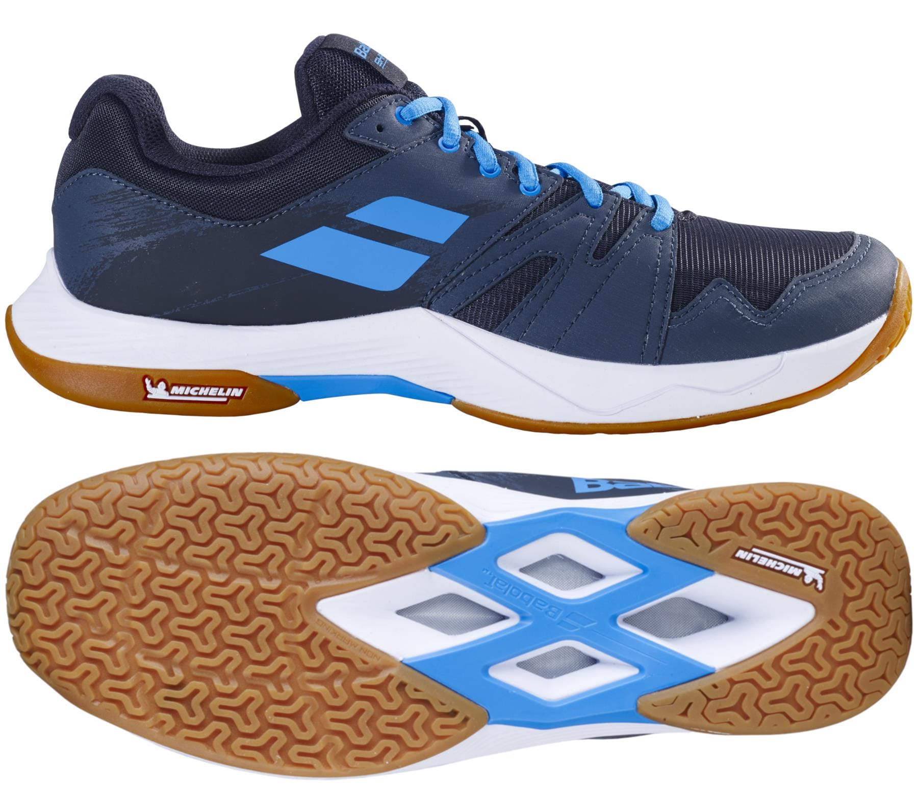 The Babolat Shadow Team 2 Men's Badminton Shoes in black and grey feature a gum sole with Michelin Rubber; side and bottom views showcase the tread pattern and color details.