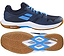 The Babolat Shadow Team 2 Men's Badminton Shoes in black and grey feature a gum sole with Michelin Rubber; side and bottom views showcase the tread pattern and color details.