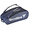 The Tecnifibre Tour Endurance 2023 12 Racket Badminton Bag in navy blue, made from durable tarpaulin fabric, offers a spacious zippered main compartment and an adjustable shoulder strap. The bold white Tecnifibre brand name along the side ensures both style and functionality.