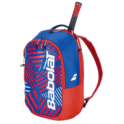 The Babolat Kids Badminton Backpack in blue/red features a geometric pattern, side pocket for racket handles, a large main compartment, and two adjustable shoulder straps—ideal for young athletes.
