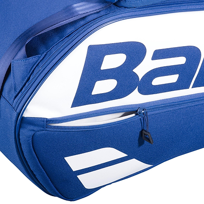 Close-up of the Babolat Court L 9 Racket Badminton Bag in dark blue, featuring a visible zipper pocket, part of the bold Babolat logo, and a white graphic design. Made from recycled PET for both style and sustainability.