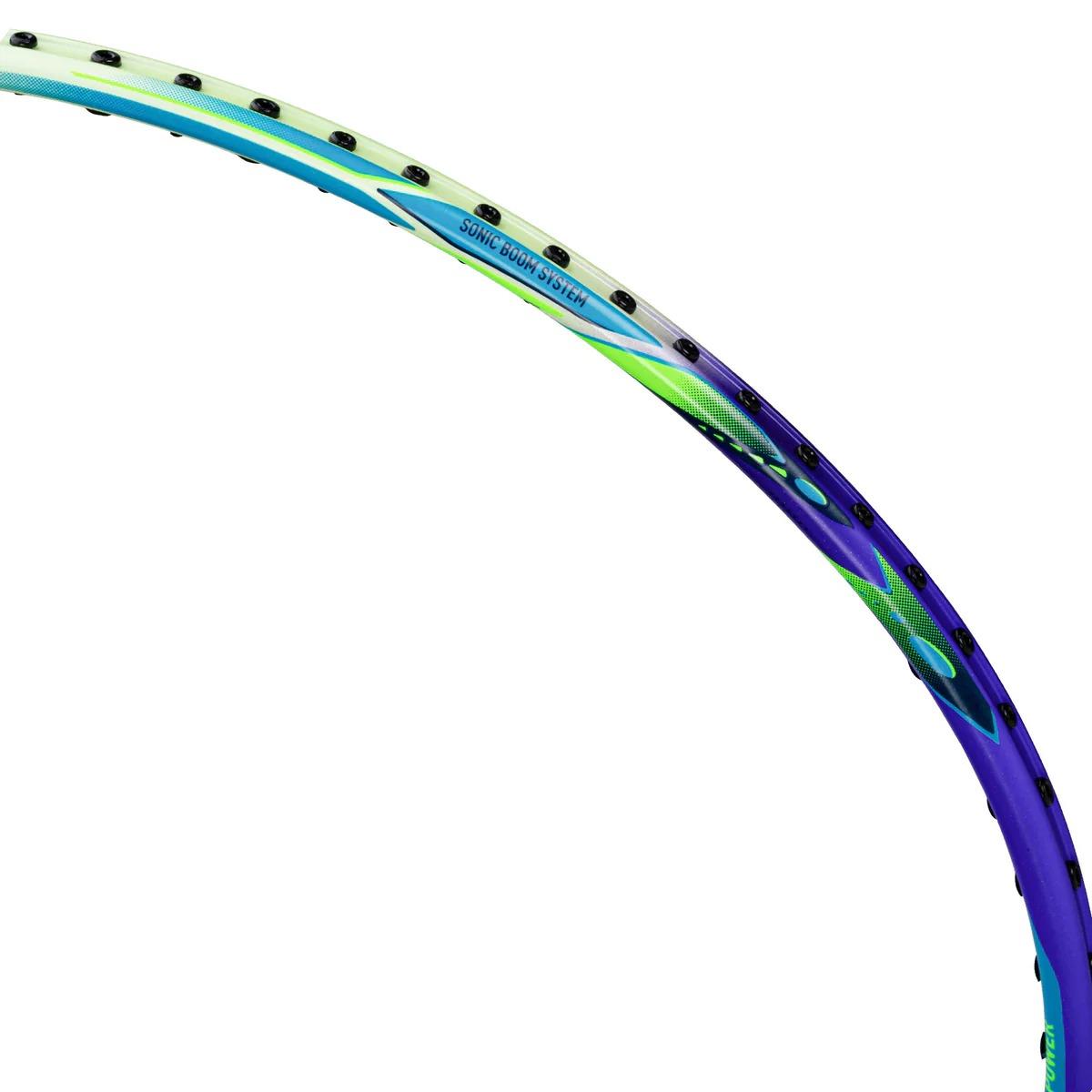 Close-up of the Li-Ning Windstorm 72 Power 6U Badminton Racket in purple, showing its lightweight edge with string holes, "Sonic Boom System" text, and TB Nano Technology.