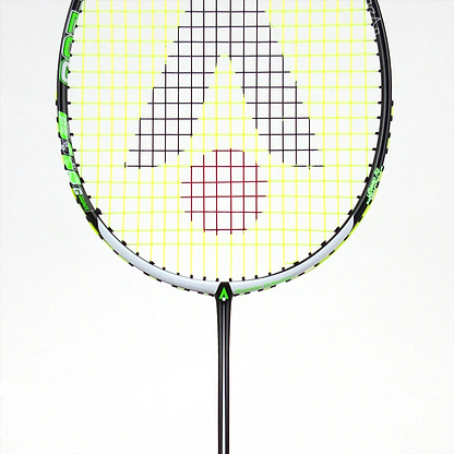 Close-up of a Karakal Black Zone BZ 20 2.1 badminton racket with yellow strings and a red center pattern. The isometric head frame is mainly black, accented in green and gray, on a plain white background.