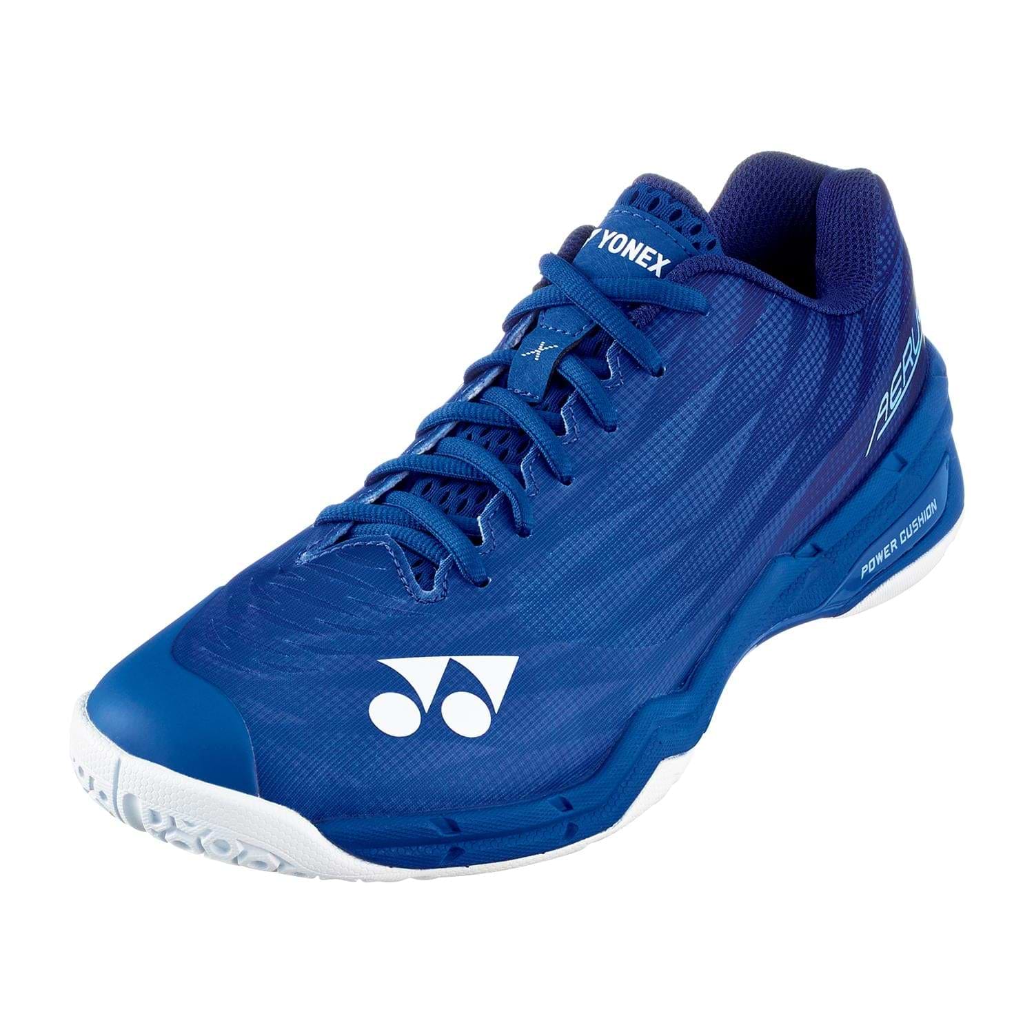 The Yonex Power Cushion Aerus X2 Unisex Badminton Shoes in navy blue feature white branding, a textured upper, lace-up closure, and a shock-absorbing Power Cushion with a white sole—perfect for indoor court play.