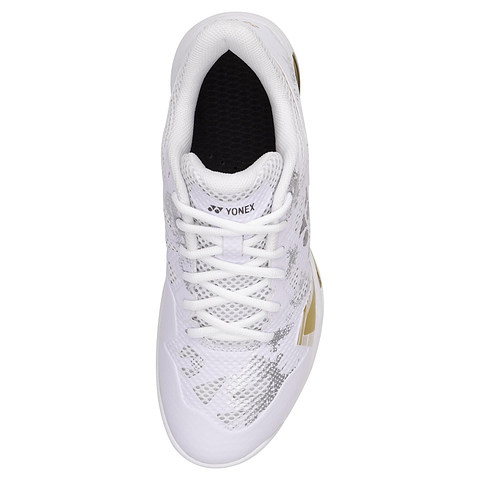 Top view of Yonex Power Cushion Eclipsion Z3 Men's Badminton Shoes in white/gold, featuring gray geometric patterns, white laces, a black interior, a logo on the tongue, gold accents on the side. Designed for dynamic performance with exceptional cushioning and repulsion.