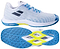 The Babolat Shadow Spirit 2 Mens Badminton Shoes in White/Algier Blue are shown from the side and bottom, highlighting their textured Michelin outsole with blue rubber grip and yellow accents.