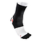 A McDavid 2-Way Elastic Ankle Sleeve in black and white is displayed on a foot. Its breathable fabric incorporates a reinforced heel and toe area highlighted with a red accent, offering elastic ankle support for comfort during athletic activities.