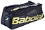The Babolat Cross Pro Badminton Bag - Black / Gold features a thermoformed shell, multiple zippered compartments, and the Babolat logo on the side.