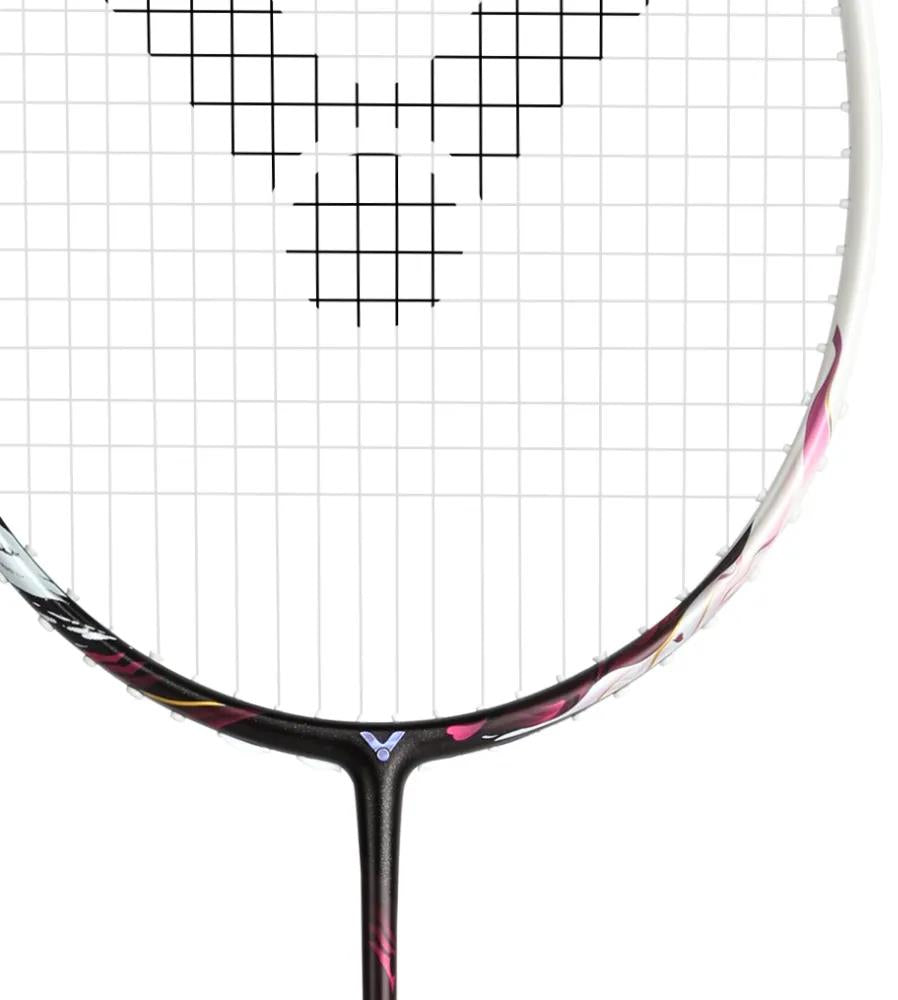 Close-up of the Victor Auraspeed Fantôme AF 4U Badminton Racket by Victor, highlighting its black strings with a geometric pattern, part of the frame, Nano Aerogel technology, and a small logo near the shaft.