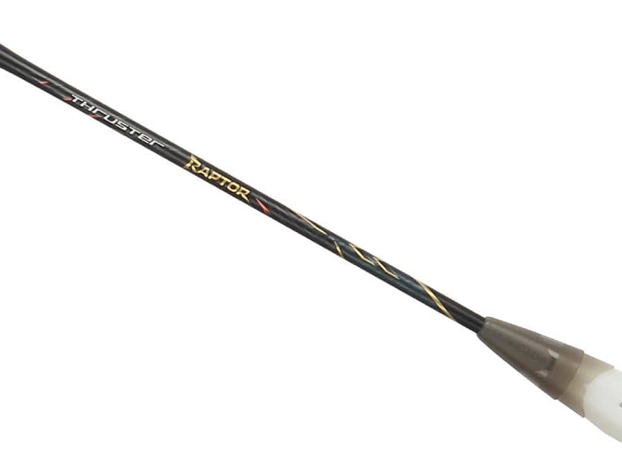 A close-up of the Victor Thruster Raptor C 4U Badminton Racket by Victor in black and gold, featuring "THRUSTER RAPTOR" text and design elements that evoke attack-oriented performance.