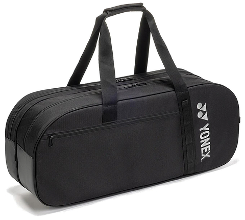The Yonex BA72631WEX Gearlogic Tournament Badminton Bag in black features two main compartments, double handles, a small front pocket, and a white Yonex logo on the side. Brand: Yonex. Positioned on a white background.