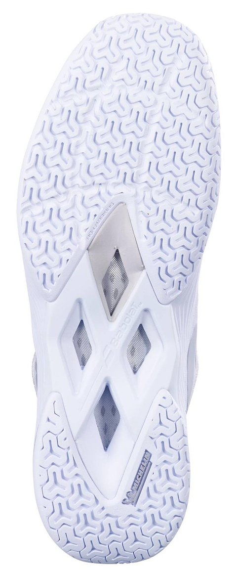A close-up of the white sole on the Babolat Shadow Tour 5 Womens Badminton Shoes shows its patterned tread, triangular ventilation holes, and the Michelin logo by the heel.