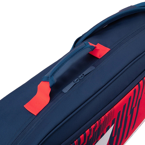 A close-up of the Li-Ning Training Series 3 Racket Badminton Bag in blue and red, featuring a prominent red accent strap, a large zipper, and part of the distinctive red and white graphic design along the side.