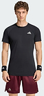 A man stands facing forward against a plain light background, wearing the adidas ADIDAS Climacool+ Freelift Pro Men’s Badminton T-Shirt in black, which features advanced cooling technology and a white adidas logo, paired with black wristbands and maroon shorts.