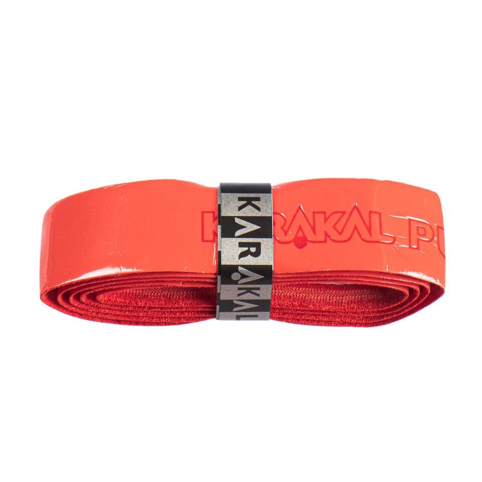 The Karakal PU Badminton Super Grip Single (Red) is a coiled grip designed for racquets, secured with a black band featuring the "Karakal" logo, ideal for passionate racket sports enthusiasts.